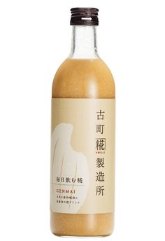 a bottle of orange juice with chinese writing on the label and an image of a woman's torso