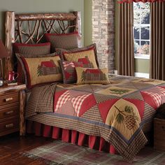 a bed room with a neatly made bed next to a dresser and window sill