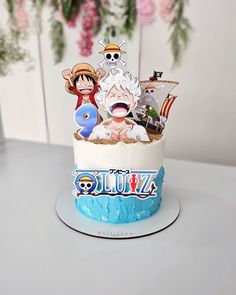 a birthday cake decorated with cartoon characters