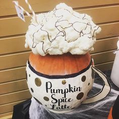 there is a pumpkin with whipped cream on top