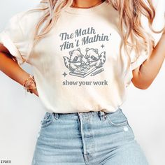 "The Math Ain't Mathin'" - Comfort Colors T-Shirt Get ready to make a statement in the classroom with this adorable Math Teacher Shirt! Perfect for the coffee-loving math enthusiast, this cute back to school tee is a must-have for any math teacher. Show some love and appreciation with this Teacher Appreciation T-Shirt, designed for the true math lover in your life. Makes a thoughtful and fun gift for a new teacher who can't resist a good cup of coffee! The Math Ain't Mathin' Math Teacher Shirt, Teacher Things Shirt Math, Teacher Gift T-shirt, Cute Teacher Shirts Math, Teaching Shirts Ideas, Funny Math Teacher Shirts, Math Teacher Outfits, Funny Teacher Tshirts, Math Tshirt, Teaching Clothes