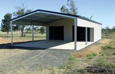 a metal building with two garages on the side and one door open to let in lots of light