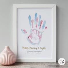 a pink and blue hand print with the words daddy, mommy & sparkle on it