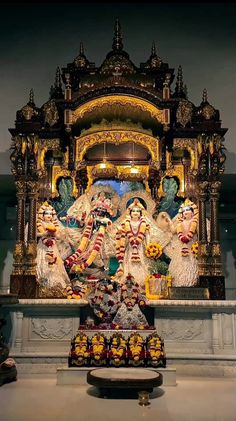 there are many statues in front of the altar with words written on it that read, they say i love india