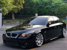 a black car parked in a parking lot