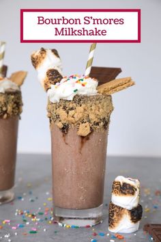 two glasses filled with chocolate milkshakes and marshmallows