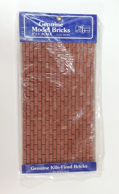 a bag of red brick sitting on top of a white table