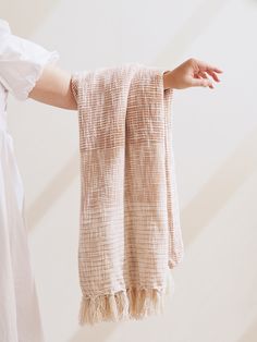 a person holding two towels in their hands