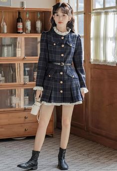 This preppy mini dress features a modest high neckline, button-down closure, faux pockets at the chest and hips, and frilly cuffs. Its shoulders are slightly puffed for an exquisite sense, and the skirt is pleated at the hem with a longer lining to produce an underskirt effect. A belt is included to cinch the waist. S: 32" chest, 25" waist, 30" lengthM: 33.5" chest, 26.5" waist, 30.5" lengthL: 35" chest, 28" waist, 31" lengthXL: 36.5" chest, 29.5" waist, 31.5" length Preppy Mini Dress For Fall, Preppy Long Sleeve Dresses For Fall, Preppy Dresses For Fall Workwear, Preppy Dresses For Work In Fall, Preppy Mini Dress For Work, Preppy Fall Workwear Dresses, Long Sleeve Mini Dress With Ruffle Hem For Work, Mini Dress With Button Cuffs For Work, Workwear Mini Dress With Button Cuffs