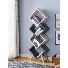 a bookshelf with four shelves in the corner