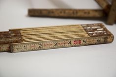 a wooden ruler sitting on top of a white table