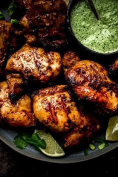 grilled chicken with cilantro sauce on a plate