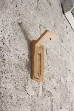 a wooden object mounted to the side of a wall