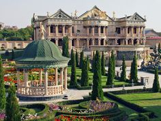 an ornate building with lots of trees in front of it