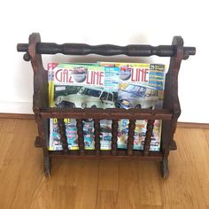 a wooden magazine rack with magazines on it