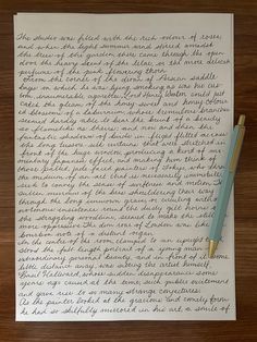 a handwritten letter on top of a piece of paper next to a fountain pen