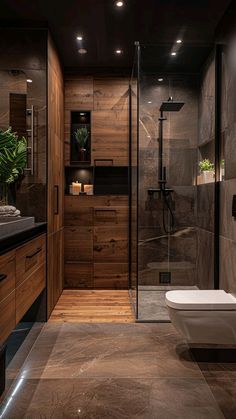 a bathroom with a toilet, sink and shower stall in it's own area