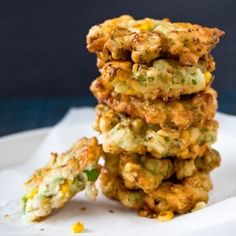 a stack of fried food sitting on top of a white plate