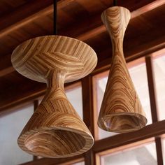 two wooden lights hanging from the ceiling