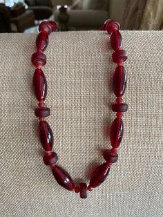 Czechoslovakia Glass Deep Red 20" Vintage Beaded Necklace Lovely made with 3 different shaped beads creating a lovely style Necklace! Metal ends and clasp  Light weighed around 2.3oz. Lovely piece to own! Thank You For Visiting :) ** I Ship Out Same Day **All questions encouraged and additional photographs will be sent upon request! Please ask all questions and thoroughly check each picture and description as ALL SALES ARE FINAL** Red Carnelian Single Strand Necklace, Red Carnelian Necklace With Faceted Beads, Red Carnelian Jewelry With Faceted Beads, Red Czech Glass Jewelry With Polished Beads, Handmade Red Carnelian Beaded Necklaces, Red Carnelian Beaded Necklace With Faceted Beads, Red Carnelian Faceted Beaded Necklaces, Red Vintage Hand-strung Jewelry, Handmade Red Oval Necklace