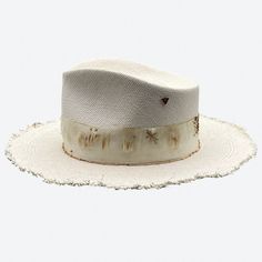 One of our best sellers, the Apollo is the perfect summer straw and a favorite with women and men. Its style is balanced with Valerias 'raw' edging and distressed details. The ultimate add to your summer style. All hats are created, shaped and detailed by Valeria Andino in her Studio. Hat Bar, Straw Fedora Hat, Doll Aesthetic, Straw Fedora, Wide Brim Fedora, Head Pieces, Doll Wardrobe, Crimp Beads, Hat Ideas