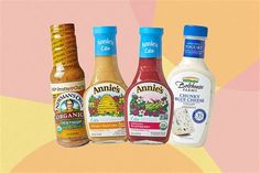 three bottles of dressing are shown on a multicolored background with the same product