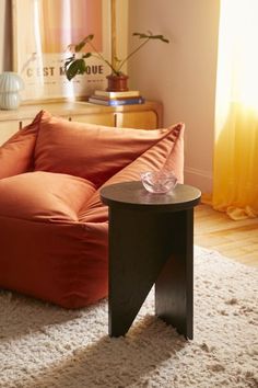 a living room scene with focus on the couch and coffee table in the foreground