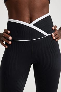 Our signature Veronica Leggings with a twist - this crossover-waistband style is ultra flattering and features a contrast binding for a fresh update to your next active look. Crossover waistband High waist Medium impact 25" inseam 9 3/4” rise Fabric: Active Rib - our signature fabric - ultra-flattering, smoothing, and moisture wicking active rib 85% Nylon 15% Spandex Machine wash cold, lay flat dry Made in the USA Cheap Women's Sportswear Leggings, Cheap Fitted Women's Legwear, Cheap Relaxed Fit Long Sleeve Activewear, Cheap Mid-thigh Length Activewear, Black Athletic Outfit, Team Leggings, Meredith Blake, Athletic Wear Womens, Sporty Leggings