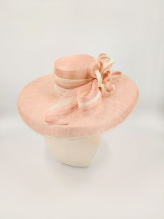 Sinamay hat in pale pink and ivory. Perfect for the Kentucky Derby and weddings. Also available in tan. This hat is more pink in person. Much like the photos with the model. Pink Wedding Hat, Hats And Fascinators, Sinamay Hats, Wedding Hat, Kentucky Derby Hats, Elegant Hats, Louisville Kentucky, Handmade Hat, Wedding Hats