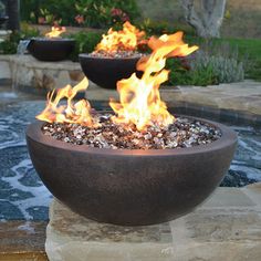 a fire pit sitting on top of a stone slab