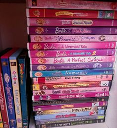 a stack of children's dvds sitting next to each other