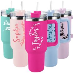 four different colored tumblers with straws in them and one has the words on it