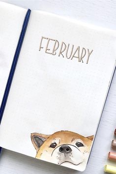 an open notebook with a drawing of a dog's face and the words february written on it