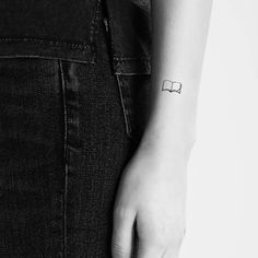 a person with a small tattoo on their arm