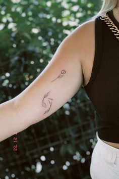 a woman with a tattoo on her arm