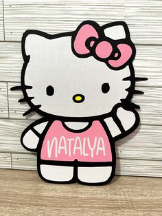 a hello kitty sticker with the word nattalya on it's chest