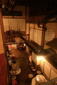 an overhead view of a living room and dining area in a japanese style home at night