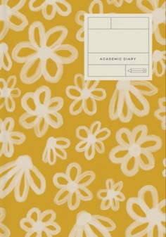 a yellow book with white flowers on the front and back cover, in an abstract pattern