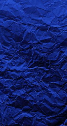 an image of blue wrinkled paper textured with crinkled lines on the edges