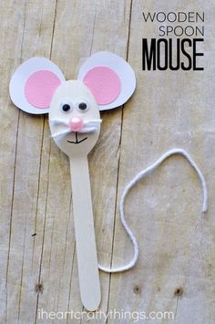 a wooden spoon with a paper mouse on it and the words, wooden spoon mouse