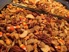 two trays filled with halloween chex mix