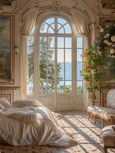 an ornate bedroom with large windows and paintings on the walls