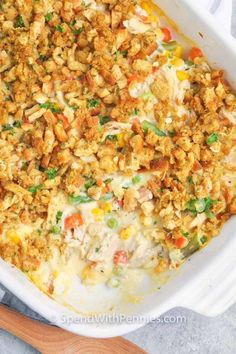 a casserole dish filled with chicken and vegetables