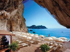 an outdoor seating area overlooking the ocean