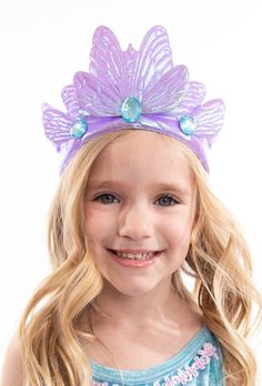 This shimmering Purple Butterfly crown will transform your little one into a lovely butterfly princess. One Size Fits Most Fabric crown with a soft foam center, designed for flexibility and made to last Has an elastic strap to ensure a secure fit Adorned with light blue sparkling jewels Dress Ups & Accessories Sold Separately ⚠️WARNING: CHOKING HAZARD 》 ⚠️WARNING: CHOKING HAZARD - For the safety of your child, size small (1-3 years) does not contain gems or other small parts. All other sizes con Butterfly Princess, Butterfly Crown, Fabric Crown, Jewel Dress, Fairy Wings, Purple Butterfly, Little One, Ups, Light Blue