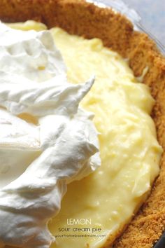 a pie topped with whipped cream and sour cream