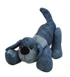 a stuffed dog is laying down on the ground