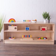 a wooden toy shelf with toys on it