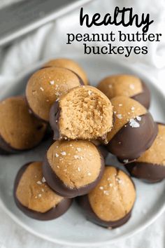 a plate full of chocolate covered cookies on top of a table