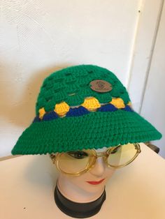 Hand made with 100% Acrylic yarn Adult Hat (S/M) 8 in. Length 24 in. Circumference Retro Crochet Cap For Summer, Retro Crochet Hat For Spring, One Size, Retro Crochet Bucket Hat For Vacation, Vintage Crochet Cap Hat, Retro Crochet Hat In Yarn, One Size, Retro One Size Crochet Hat For Spring, Retro One-size Crochet Hat For Spring, Trendy Green Crochet Hat For The Beach, Trendy Green Crochet Hat For Beach